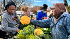 Recipients shop at a pop-up farmers’ market at the Raymond Memorial Library in East Hartford November 29th, 2023. The town is partnering with End Hunger CT! and Killam & Bassette Farmstead to offer a last chance for residents with Senior Farmers’ Market Nutrition Program (SFMNP) and Women, Infants and Children (WIC) benefits to use them before the programs expire on November 30th.