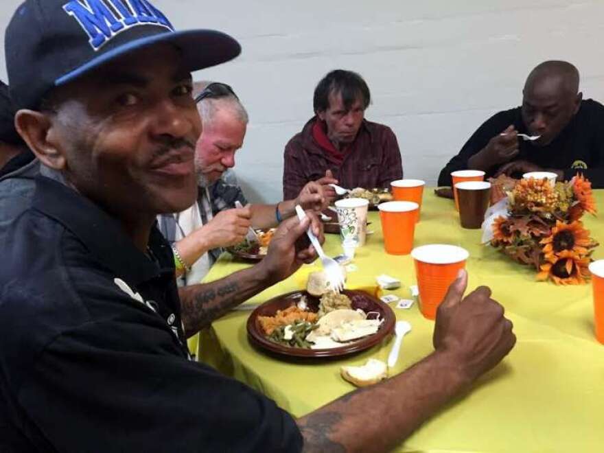 Vincent Williams (left) works for a moving company, but his income dropped dramatically when business slowed a couple of months ago. Photo: Renata Sago, WMFE.