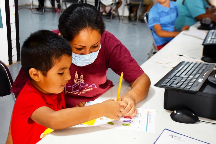 Mother and son work on homework