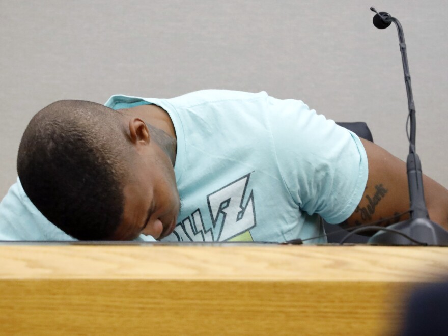 Joshua Brown, a neighbor of victim Botham Jean, is overcome with emotion while giving testimony in court in Dallas during the murder trial of Amber Guyger. Ten days after his testimony, Brown was killed in a shooting that remains under investigation.