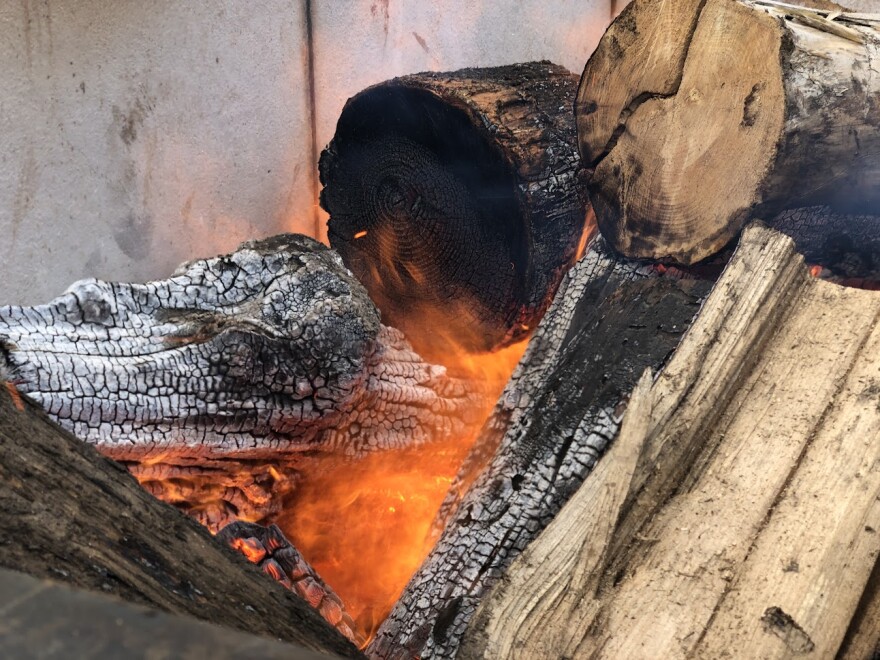 Collected wood burns away inside the main chamber of the CharBoss.
