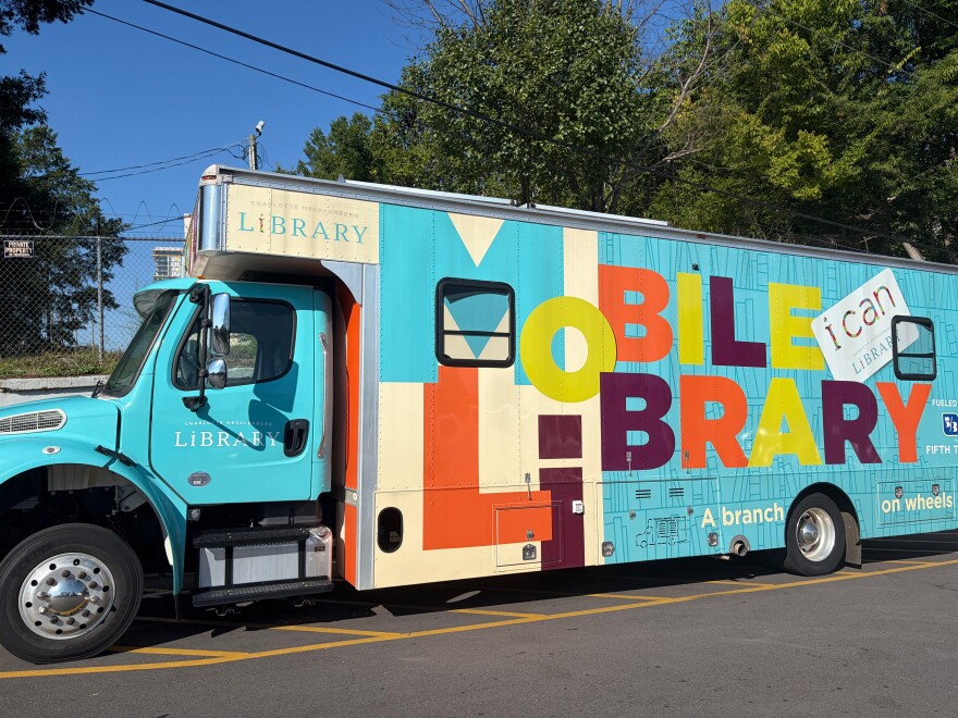 Charlotte Mecklenburg mobile library parks outside of the Roof Above Day Services Center.