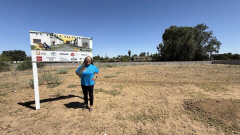 Allysunn Walker stands on currently empty land that belongs to the West Side Church of God in Fresno, Calif. The site will eventually house seniors on fixed incomes.