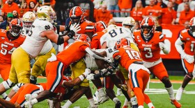 The Syracuse defense tries to stop the Notre Dame run game. The Fighting Irish ran for 246 yards last Saturday