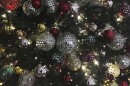 FILE - In this file photo, ornaments hang on a Christmas tree on display in New York.