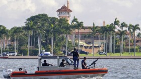 The U.S. Coast Guard patrol boat passes President Donald Trump's Mar-a-Lago estate in Palm Beach, Fla., Thursday, Nov. 22, 2018. (J. David Ake/AP)