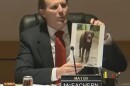 Portsmouth Mayor Deglan McEachern holds up a photo of "Frankie," the dog electrocuted behind Portsmouth High School, before issuing an apology to the dog's owner during a City Council meeting April 6, 2026.