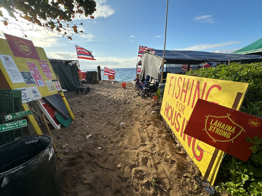 Housing was identified as a major challenge by community members immediately after the 2023 wildfires, which exacerbated an already-existing housing shortage on Maui. Pictured here, Lahaina Strong camped out on Ka'anapali Beach for months to raise awareness of the issue, seen here in January 2024. Many fire survivors, like Charles Nahale, continue to struggle to find housing options three years after the fire.