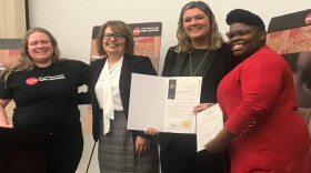 Melanie Blow, left, and Celia McIntosh, right, of the Rochester Regional Anti-Human Trafficking Coalition flank guests of the roundtable discussion.