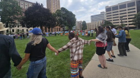 Activists, including tribal community members, opposed to the operation of the Line 5 oil and natural gas liquids pipeline, rally at the Michigan Capitol on Wednesday, August 27.