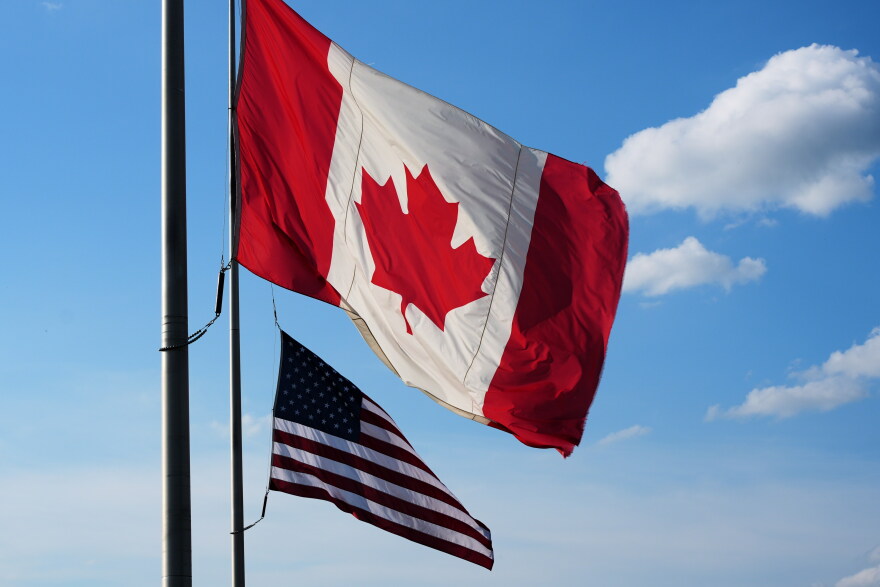 The national flags of Canada, front, and the United States fly outside the Galleria Mall in Buffalo, New York, Wednesday, Aug. 26, 2026.