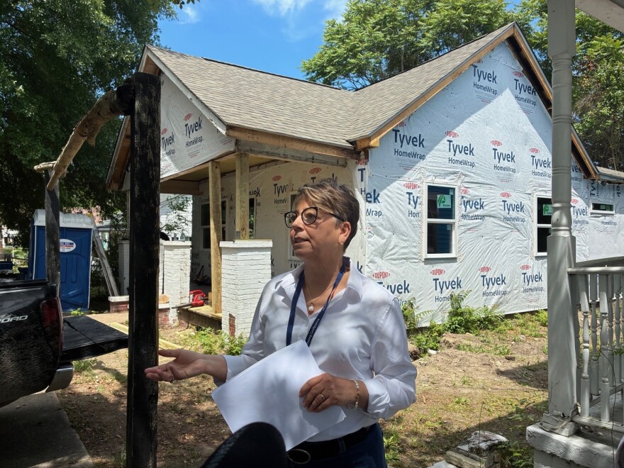 CFC's Director of Housing, Suzanne Rogers, guided local officials on a tour of homes undergoing renovations.