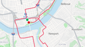 A map of Cincinnati, Newport, and Covington, with a race course marked in red.