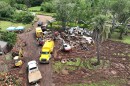 Crews clean up a property on the North Shore of Oʻahu after historic flooding over the weekend. (March 23, 2026)