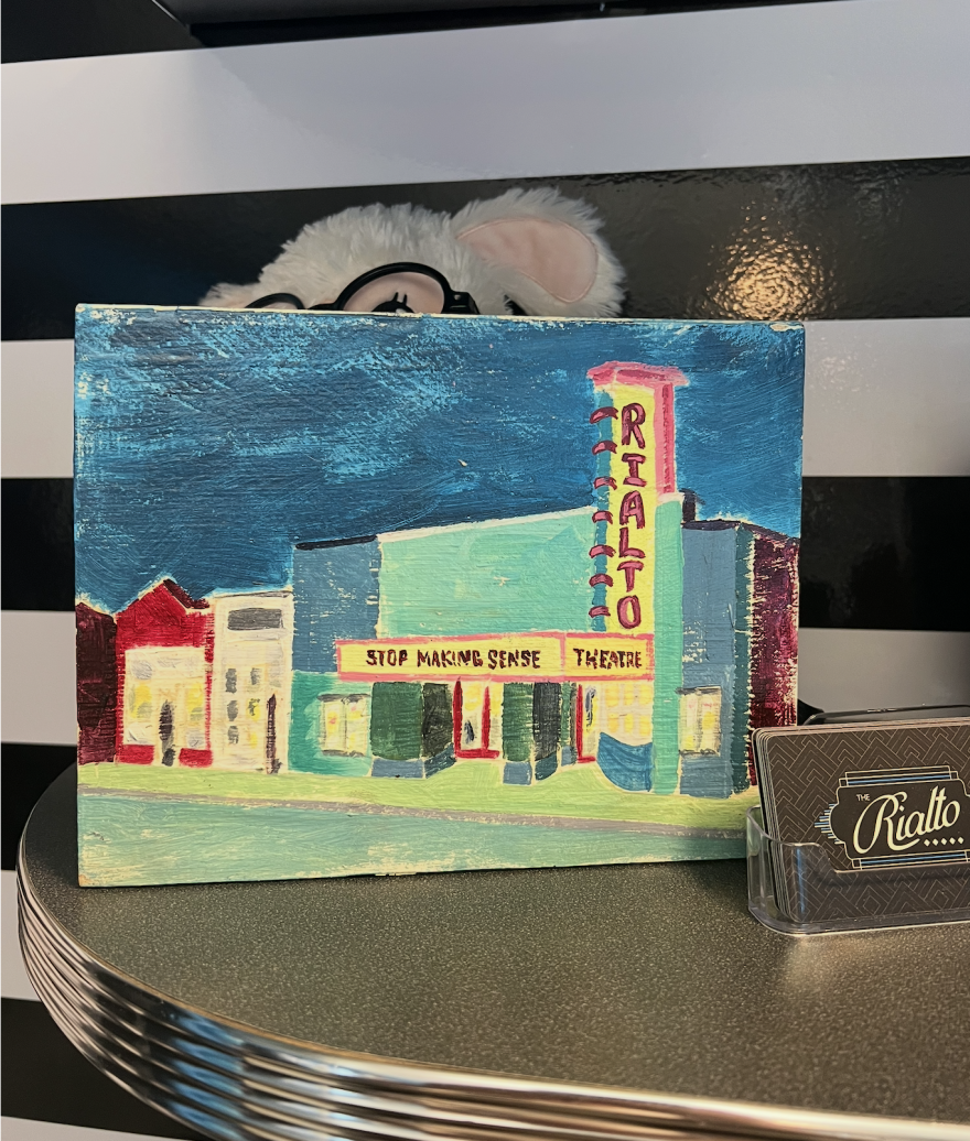 A painting of The Rialto Theatre with "Stop Making Sense" on the marquee.