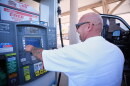 A man in a white T-shirt puts $175 of diesel in his truck at a gas station in Carlsbad, California on Thursday, Sept. 10, 2026.