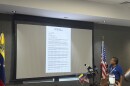 Arnoldo Diaz presents a letter from the National TPS Alliance to Trump administration officials demanding Venezuelan TPS reinstatement on July 24, 2026 in Doral. 