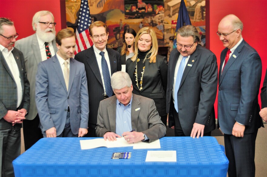 Governor Rick Snyder signing the bill that will allow for autonomous vehicles to be driven on public roads. 