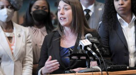  Members of the House Democratic Caucus look on as Minority Floor Leader Crystal Quade, D-Springfield, addresses the media on the final day of the legislative session on May 14, 2021. 