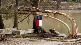 A Lone Star Flag flies at the site of deadly flooding in Kerr County, Texas.