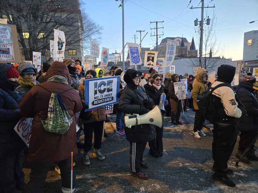  Hundreds of people showed up with signs, braving the bitter cold to show solidarity.