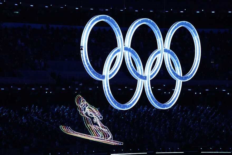 Olympic rings illuminate the opening ceremony of the 2022 Winter Olympics, Friday, Feb. 4, 2022, in Beijing. (AP Photo/Bernat Armangue)