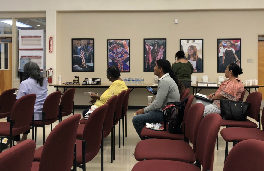 Edgewood ISD parents and community members grab breakfast tacos before a town hall May 31, 2018.