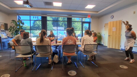 A group of actors rehearses an argumentative dinner scene at the Mancos Public Library ahead of the Golden Fox Paradox.