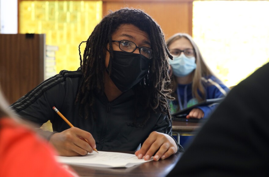 Jordan Harris takes notes during the Personal Money Management class at Hilton High School.