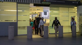 Expelled migrants enter Mexico through a gate tucked away in the second terminal of Mexico City International Airport on July 9, 2020 after being flown out of the U.S. from either San Diego, California or Brownsville, Texas by Immigration and Customs Enforcement.
