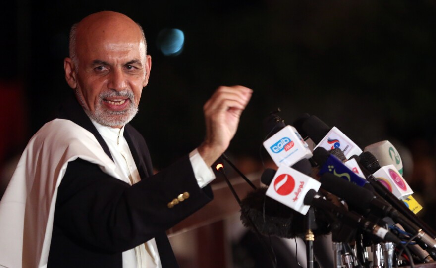 Afghan presidential candidate Ashraf Ghani speaks to the media at his residence in Kabul on June 25. Ghani finished second to Abdullah Abdullah in the first round of voting, but appears to be ahead in the runoff. Abdullah claims there was widespread fraud in the runoff voting.