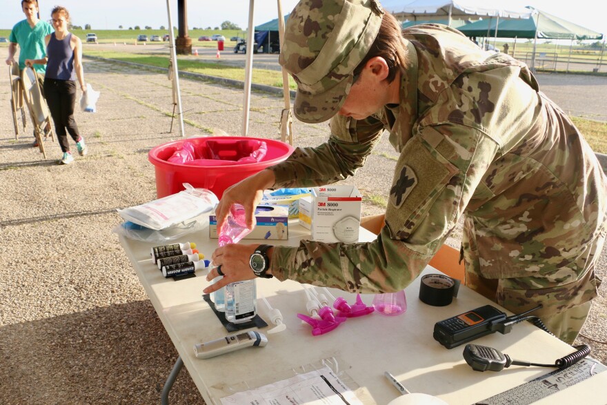 Medical workers review protocol and prepare for a day of coronavirus testing at the drive-through testing site at UNO's Lakefront Arena. April 2, 2020.