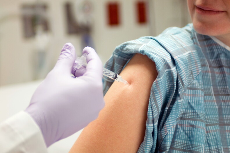 An adult gets a flu shot.