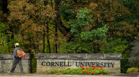 A student walks past a Cornell University sign in Ithaca, N.Y., Monday, Sept. 28, 2026.