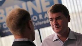 U.S. Sen. Michael Bennet (D-CO) meets with an aide at his campaign headquarters in  Colorado. Bennet was the subject of an attack ad paid for by American Crossroads.