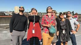 KUOW staff gathered on the garage roof to watch the eclipse. From left, Matt Albertson, Marcie Sillman, Elizabeth Hovance, Carol Smith, Ruby de Luna, Joshua McNichols.