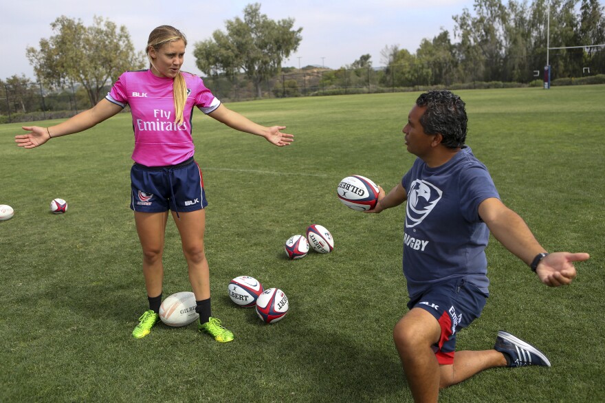 Richelle Stephens works on a move with head coach Richie Walker.