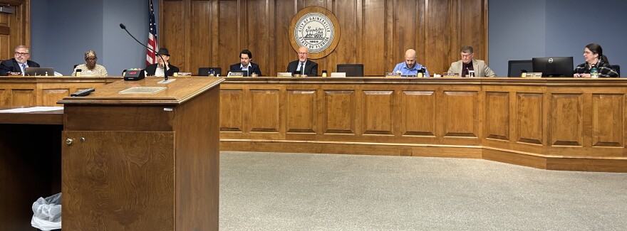Gainesville city officials take their seats before the grant status update meeting on Thursday, Feb. 27, 2025. (Martine Joseph/WUFT News)