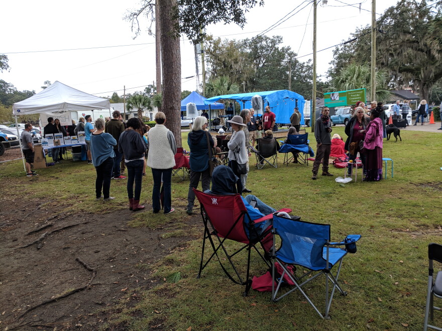 As Sunday's rains abated, the crowds grew at Lake Ella to hear the music and help the food drive.