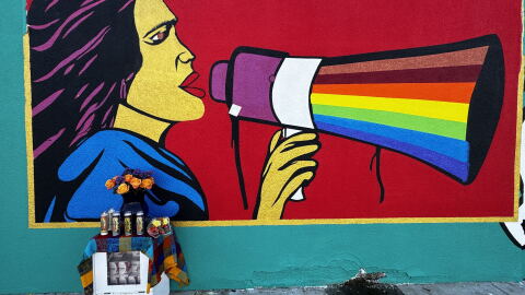 A mural of Dolores Huerta is painted outside a Bakersfield meat market.