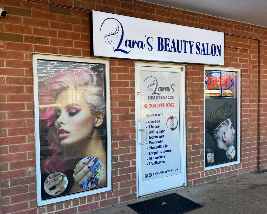 Lara's Beauty Salon in east Charlotte still keeps its front door locked to protect customers and employees.