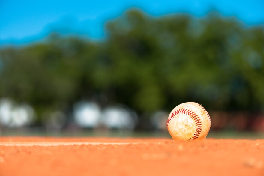 Worn baseball on pitchers mound