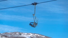 Chair lift over a snowy mountain at a ski resort in Park City, Utah.