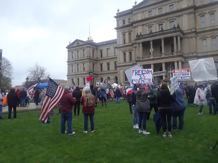 People protest at the Michigan State Capitol on April 30, 2020.