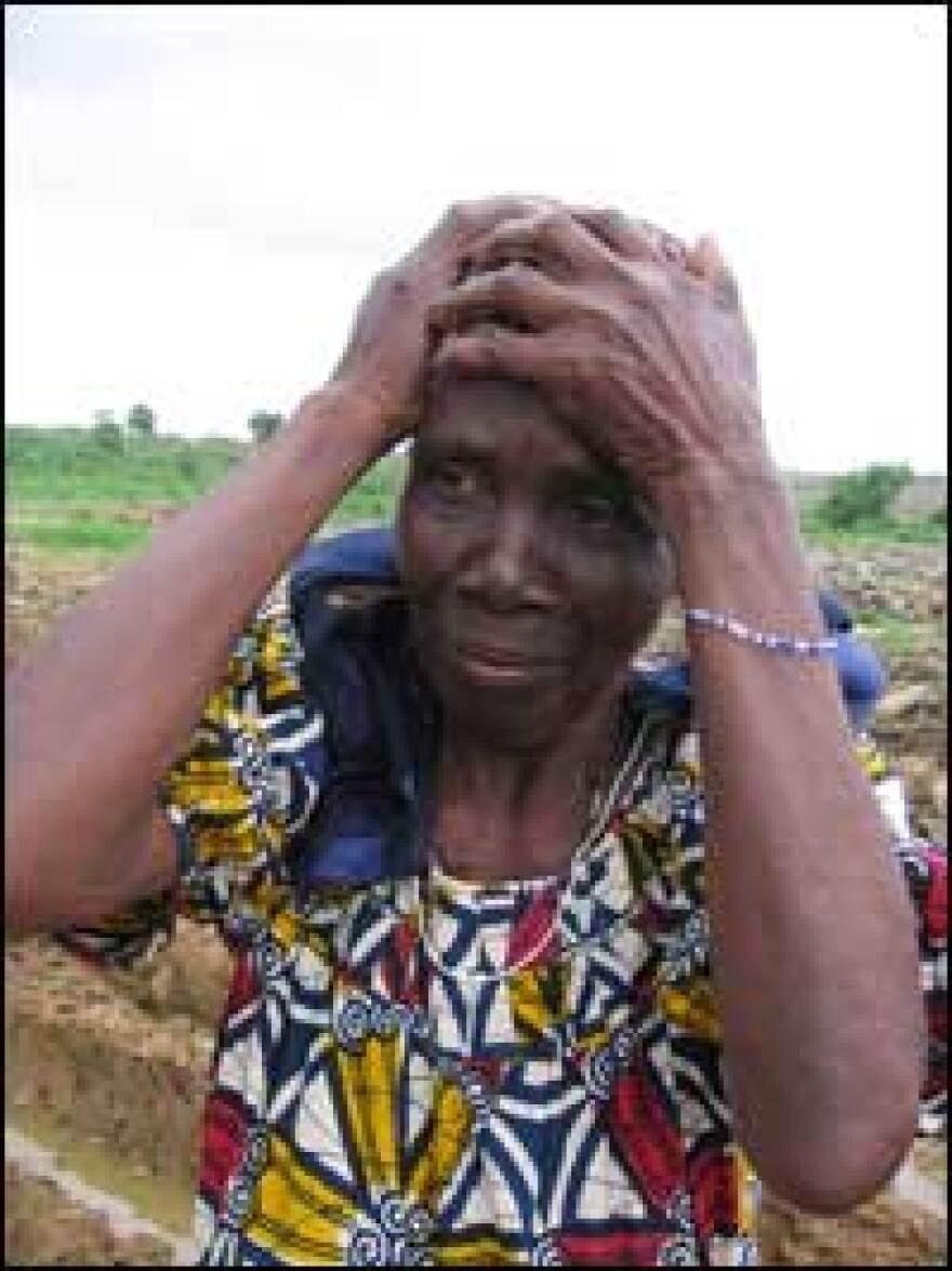 Holding her head in her hands, Madame Elizabeth Awo Djeketou remembers the day she and others woke up to the poisonous smell of the toxic waste. She says some people in her village have moved away because the stench is so pervasive.