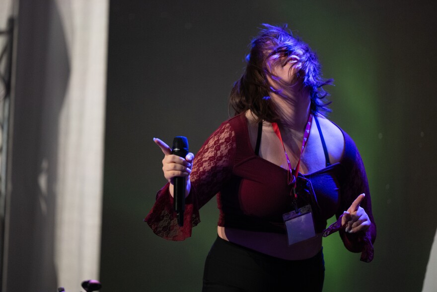 A girls dances onstage.