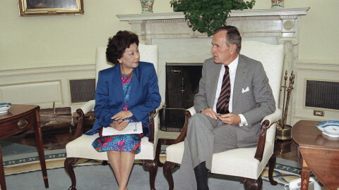 U.S. President George H. Bush meets with Small Business Administration Administrator Pat Saiki, Thursday, Sept. 3, 1992 in the Oval Office of the White House. The meeting was to discuss hurricane relief efforts in Florida and Louisiana.