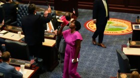Rep. Angie Nixon, D-Jacksonville, uses a bullhorn to speak on the House floor as the chamber prepared to voted on the congressional redistricting bill during a special session of the Florida Legislature, Wednesday, April 29, 2026, in Tallahassee, Fla. 