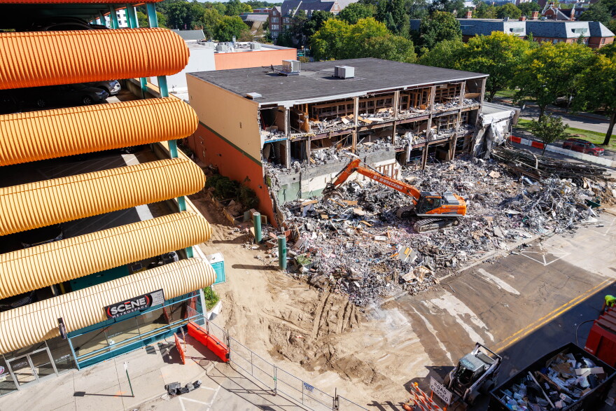 Demolition crews tear down the former Spartan Bookstore in East Lansing, Mich., on Sept. 14, 2026. A new apartment high-rise will be built on the site.