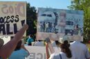 Immigration activists gathered across the Wilson FBO on Tuesday, Aug. 8, to demand the Wilson family to stop "ICE flights" out of their private terminal.